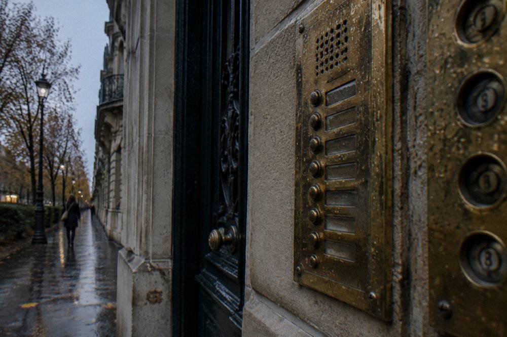 A set of Paris apartment door entry codes and intercom panels on a residential building