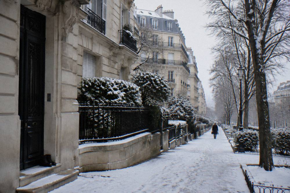 A quiet residential street in outer Paris with Haussmann-style buildings and parked bicycles